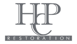 Gray &ldquo;HHP&rdquo; logo with &ldquo;RESTORATION&rdquo; in spaced white letters on a dark banner below.