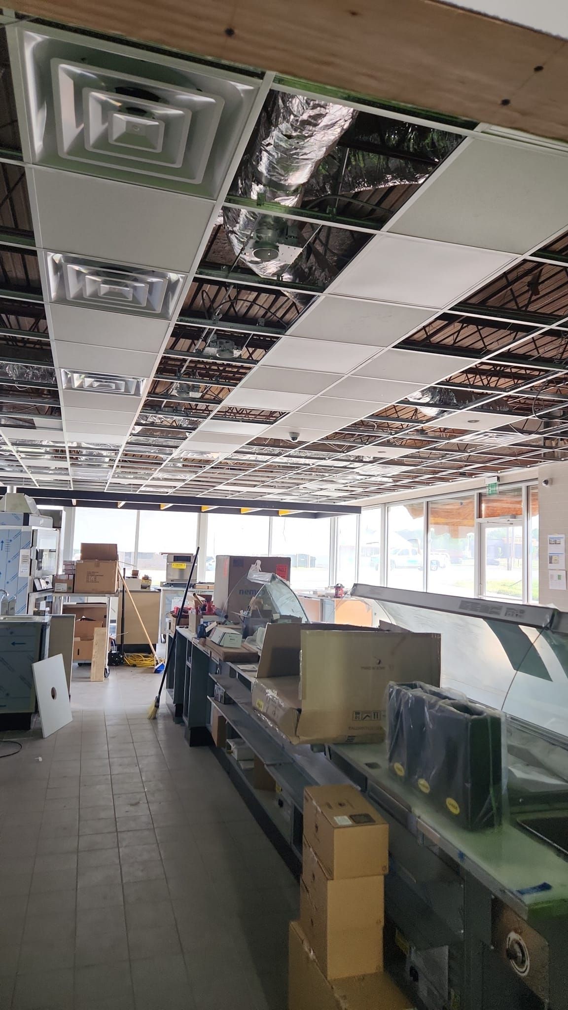 A large room with a ceiling that has a lot of boxes on it.