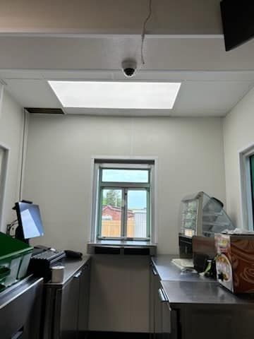 There is a window in the ceiling of the room.