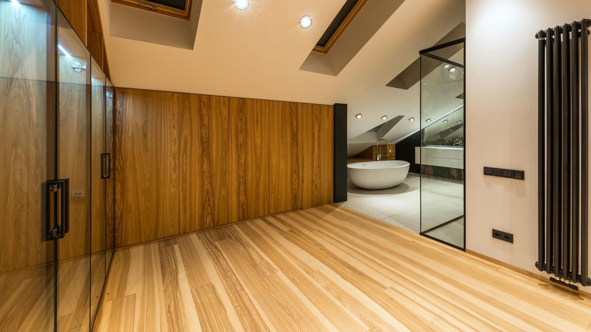 A bathroom with a bathtub and a walk in shower.