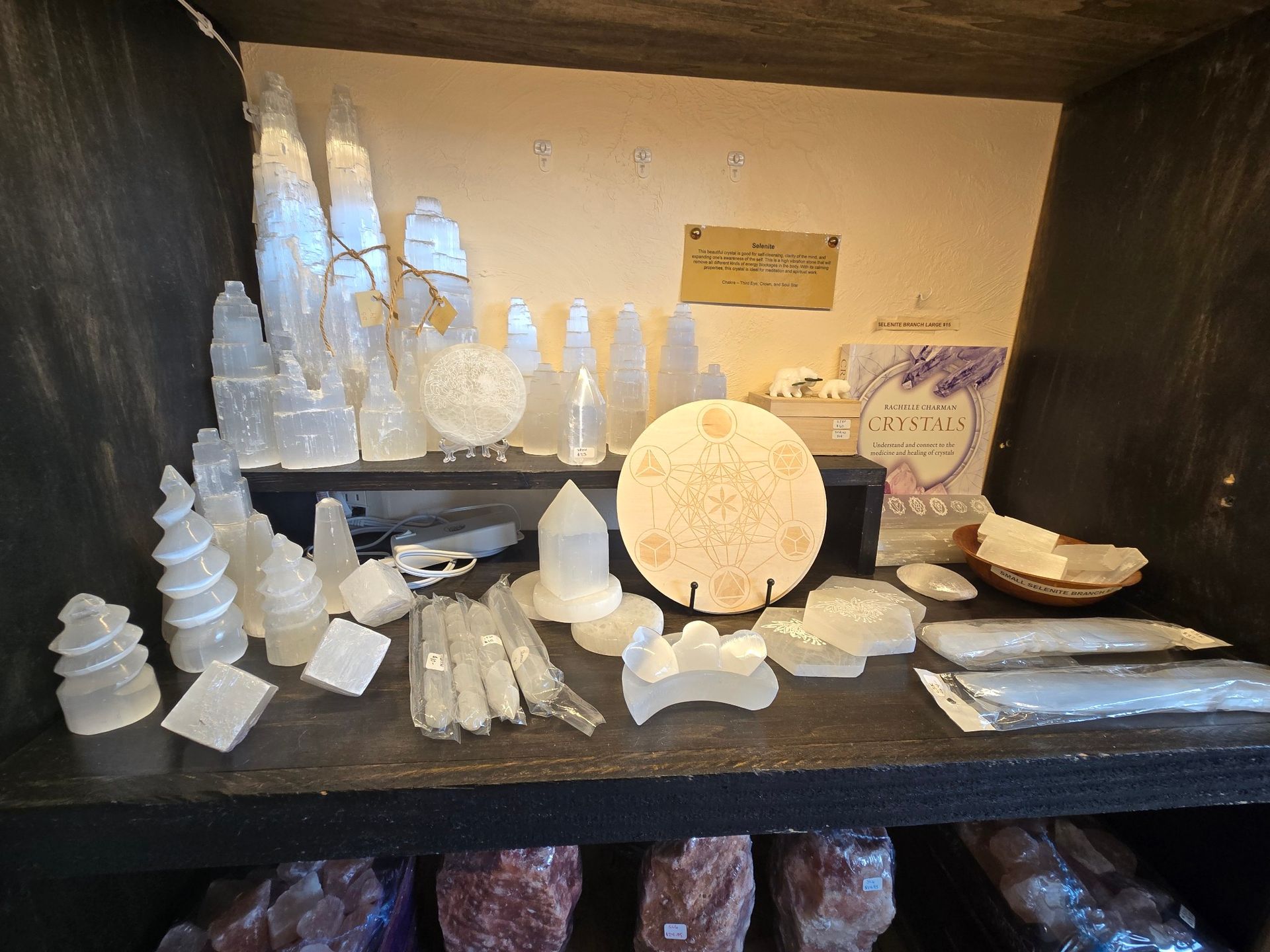 There are many different types of crystals on the shelf.