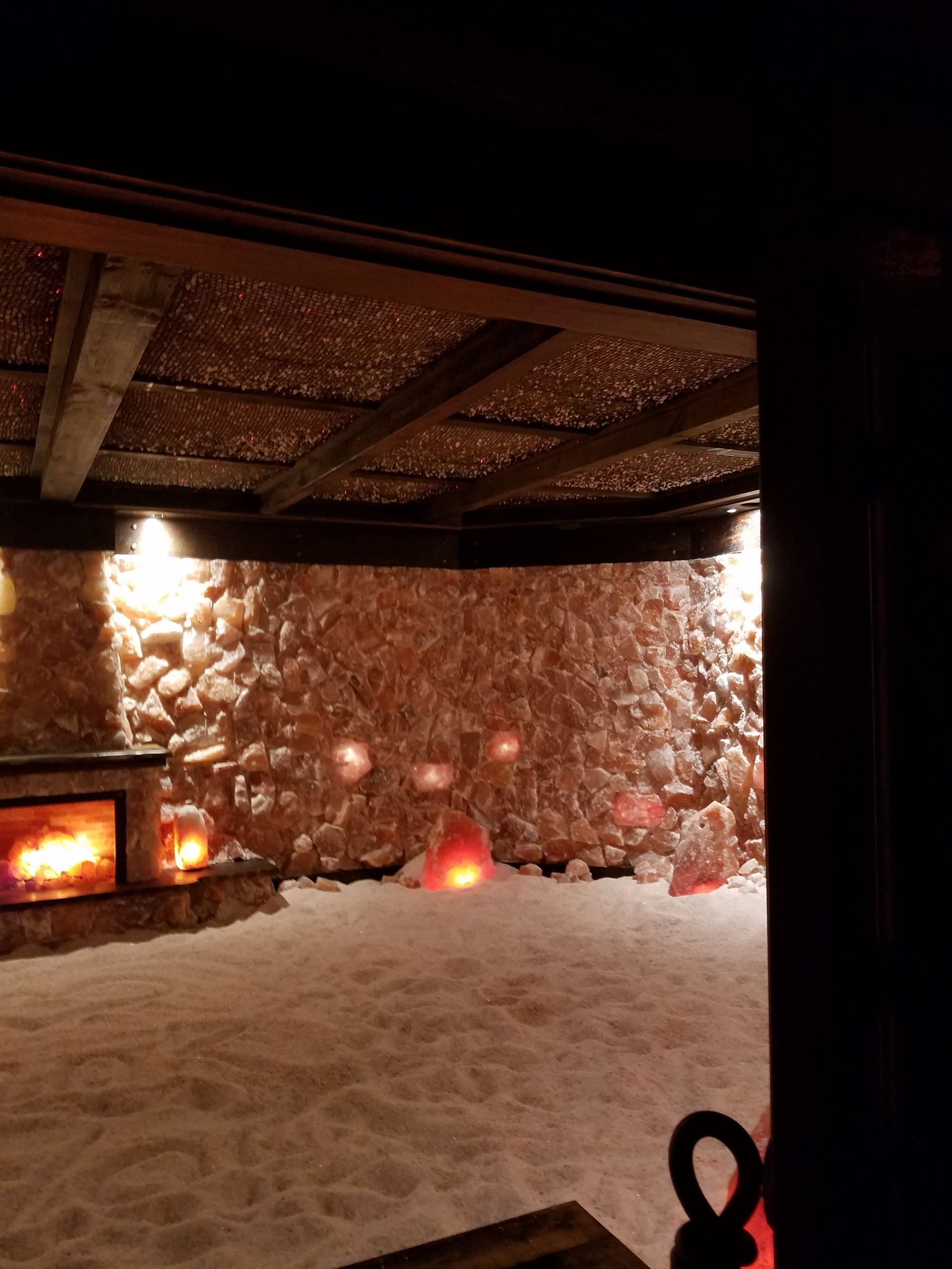 A room with a lot of rocks and candles in it.
