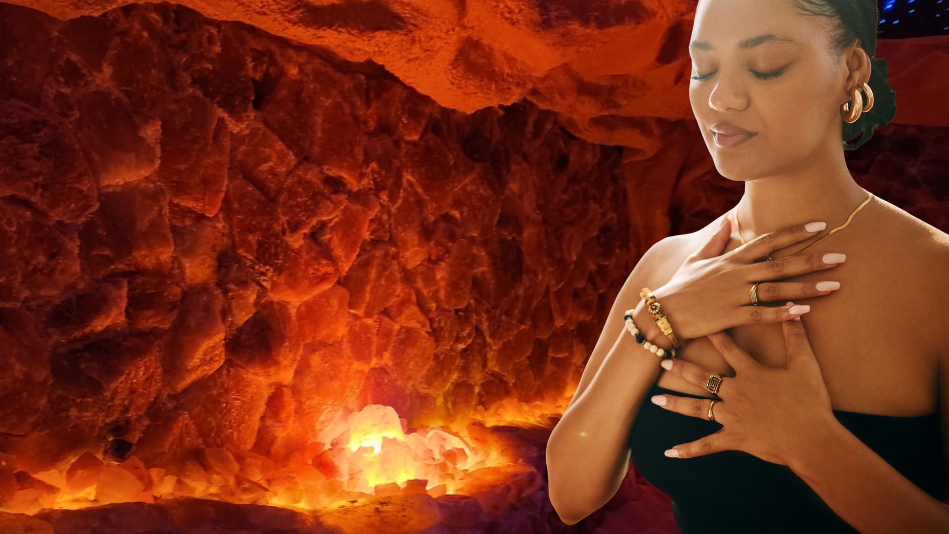 Woman in a cave, eyes closed, hands on chest. Red-orange stone background, soft light.
