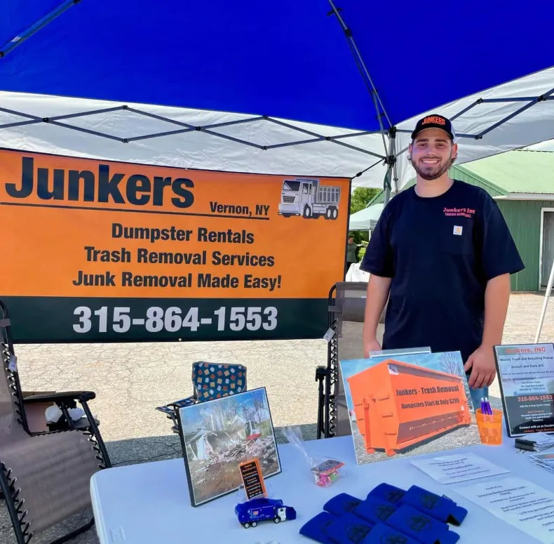 A man and a woman are standing in front of a building.