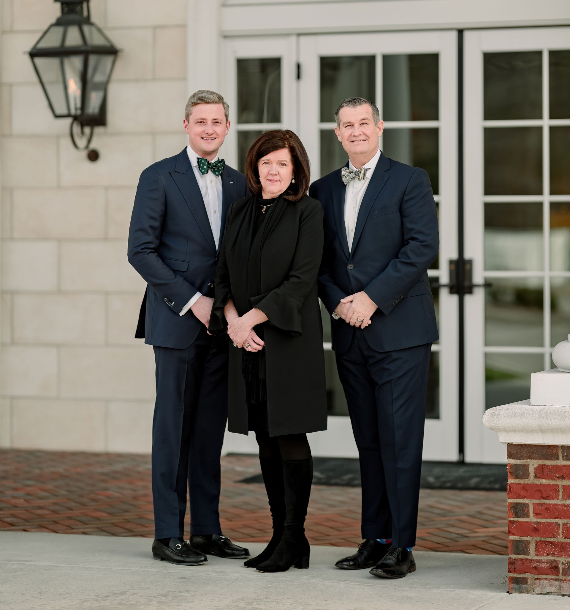 A fountain in a park with palm trees in the background