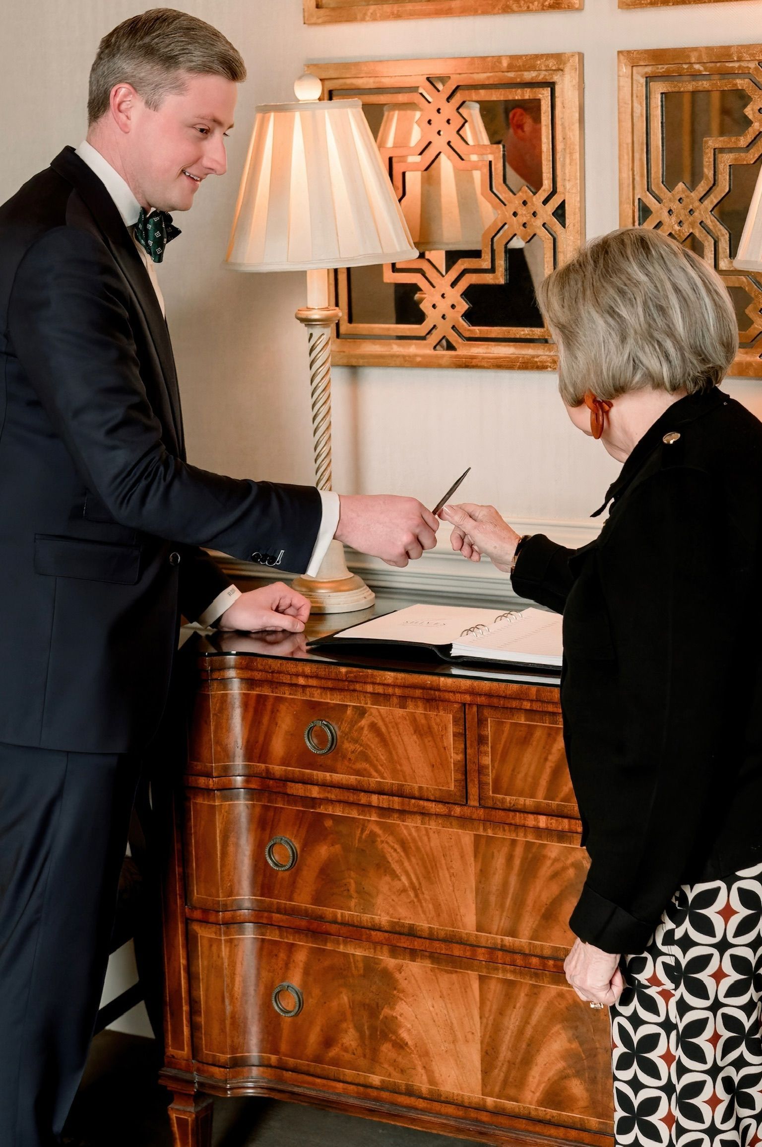 A person is holding a cell phone with five stars on it.