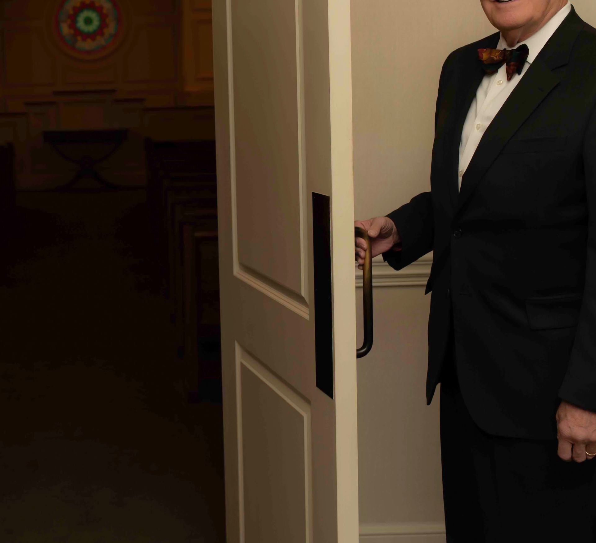 A person is typing on a laptop computer while sitting at a table.