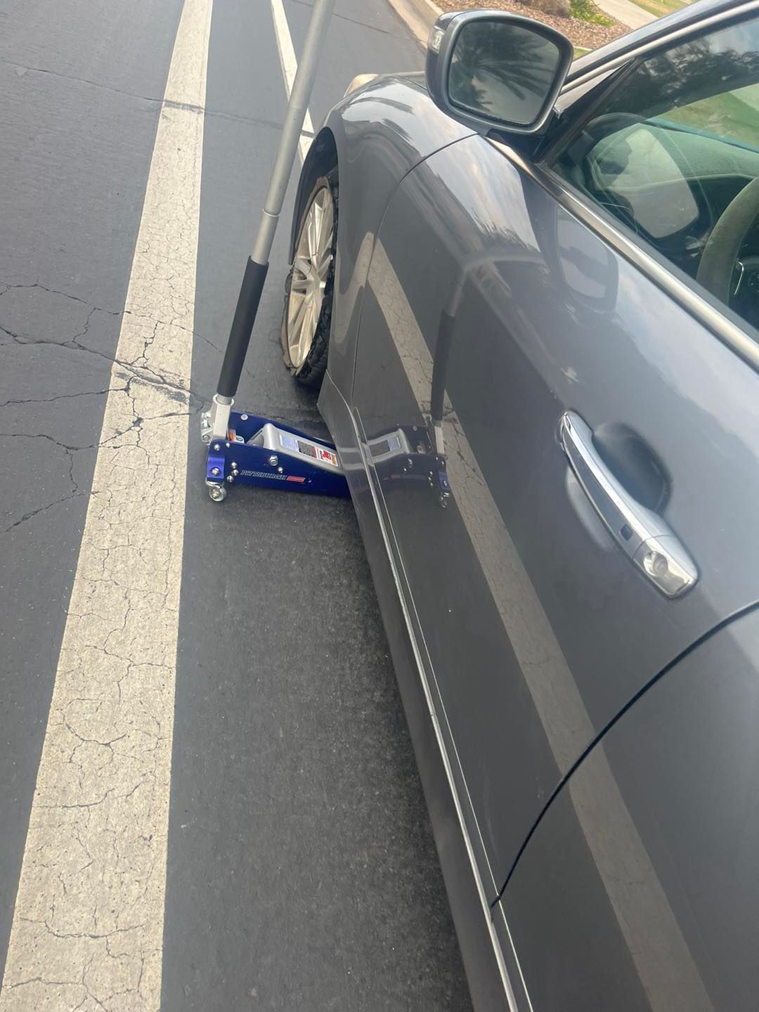 A Car With A Jack On The Side Of It — Tempe, AZ — Precision Roadside Service