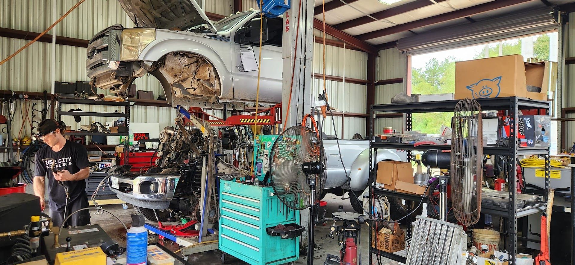 A mechanic working on a vehicle | Phase 2 Automotive