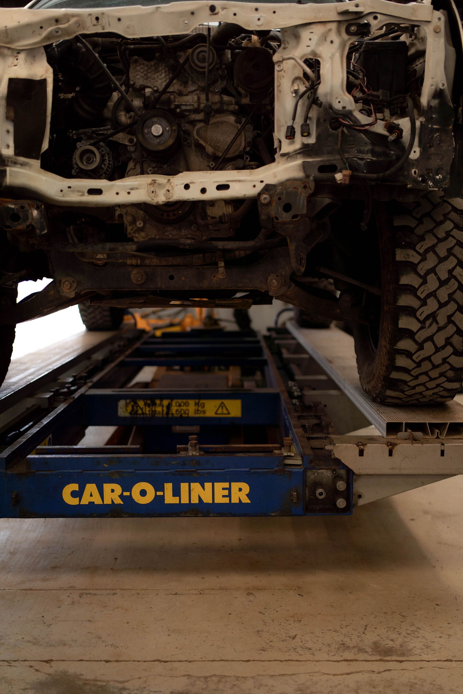 The Underside of a Truck is Shown in a Garage — Douglas Collision Management In Currajong, QLD