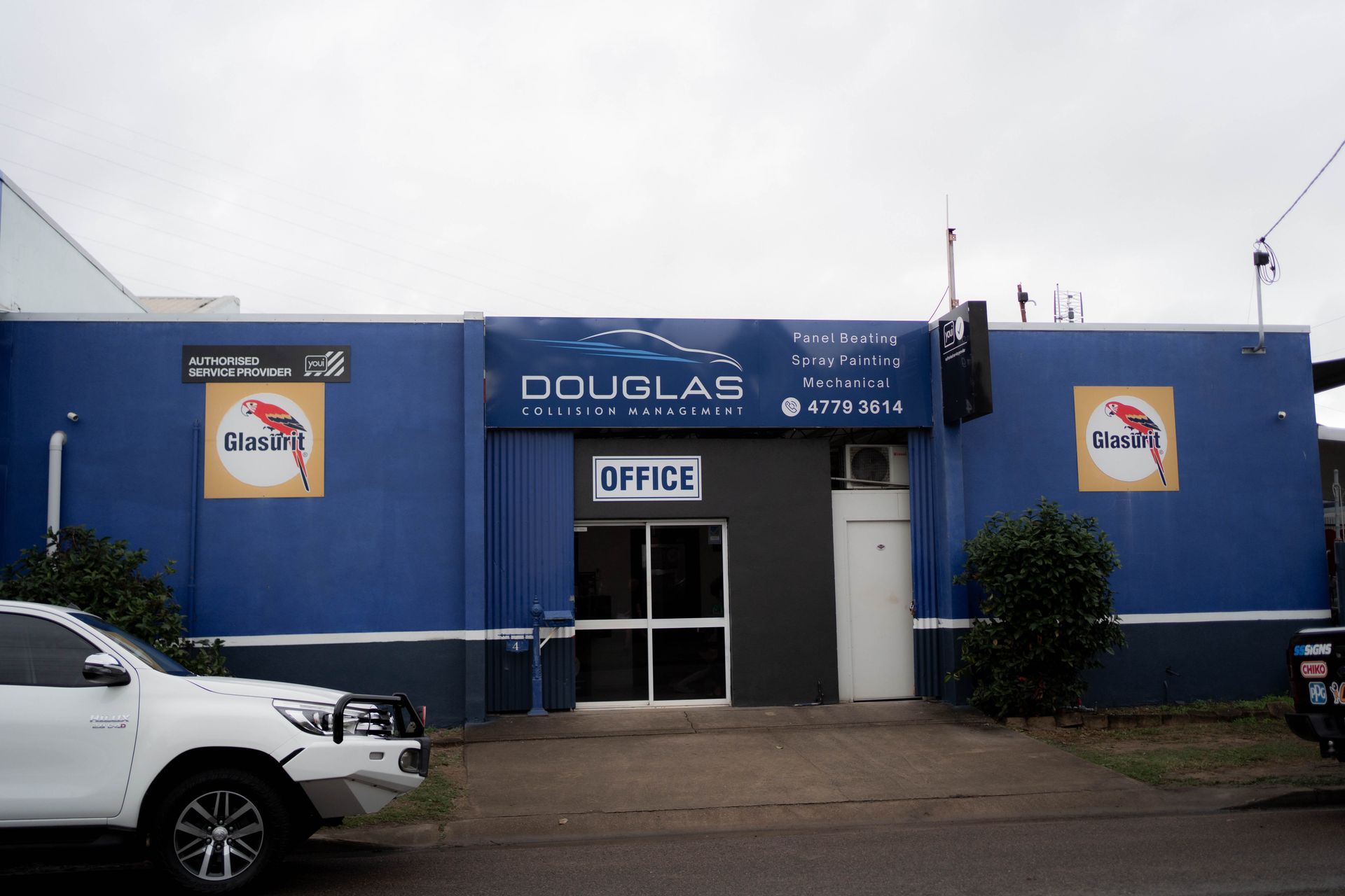 Douglas Collision Management Office Building With White Car Parked In Front — Douglas Collision Management In Currajong, QLD