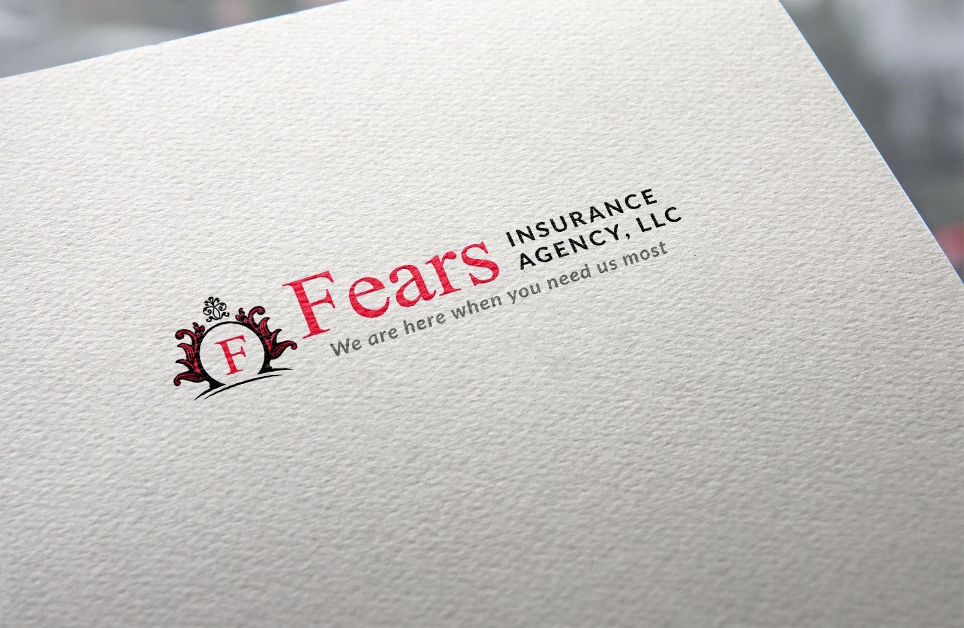 The logo for fears insurance agency llc is on a piece of paper.
