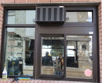 Storefront Glass — Man Installing Window in Houston, TX