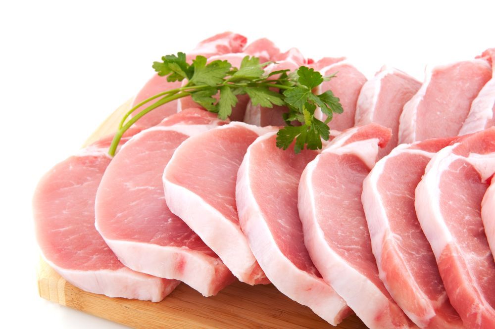 Many fresh pork chops or cutlets with parsley — Wholesale Butchery in Mudgee, NSW