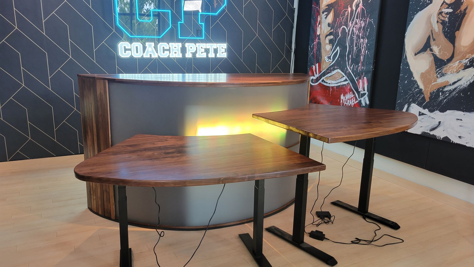A room with two tables and a sign that says coach pete