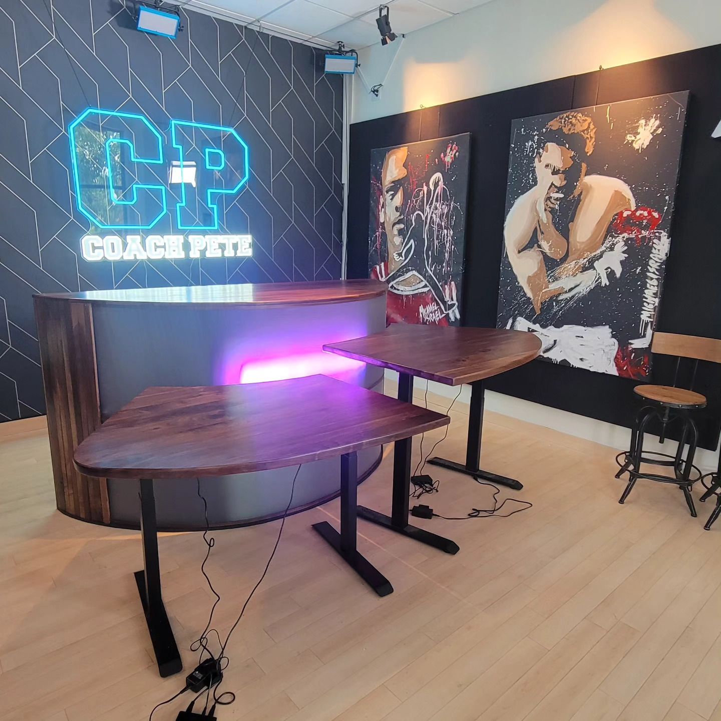 A room with tables and a sign that says coach pete