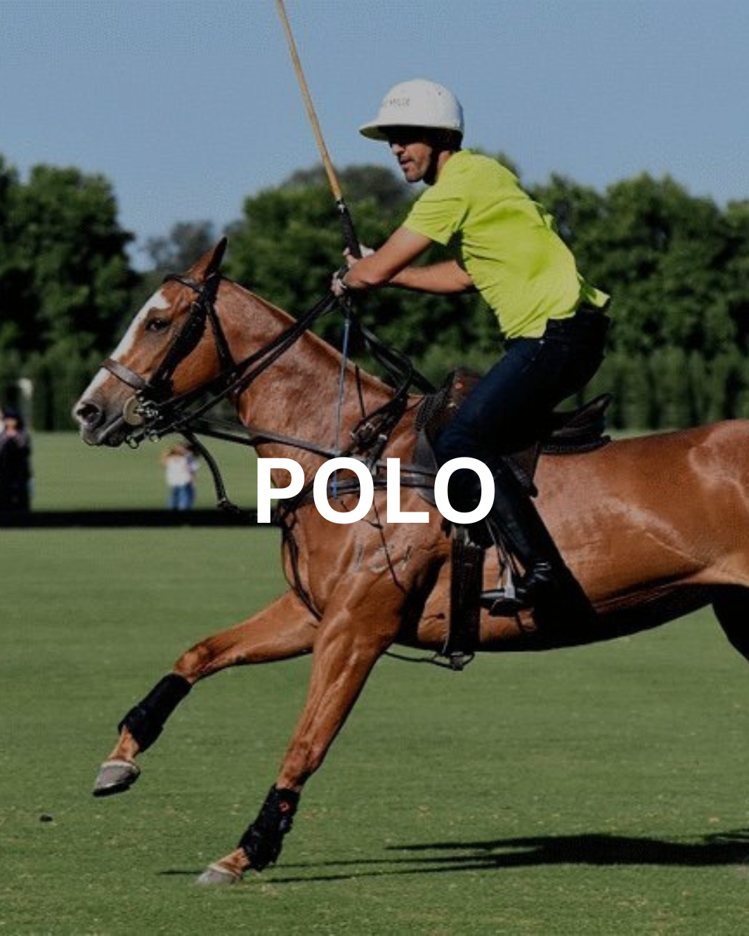 A polo player on a brown horse, swinging a mallet. Player in a green shirt, white helmet, on a grassy field.