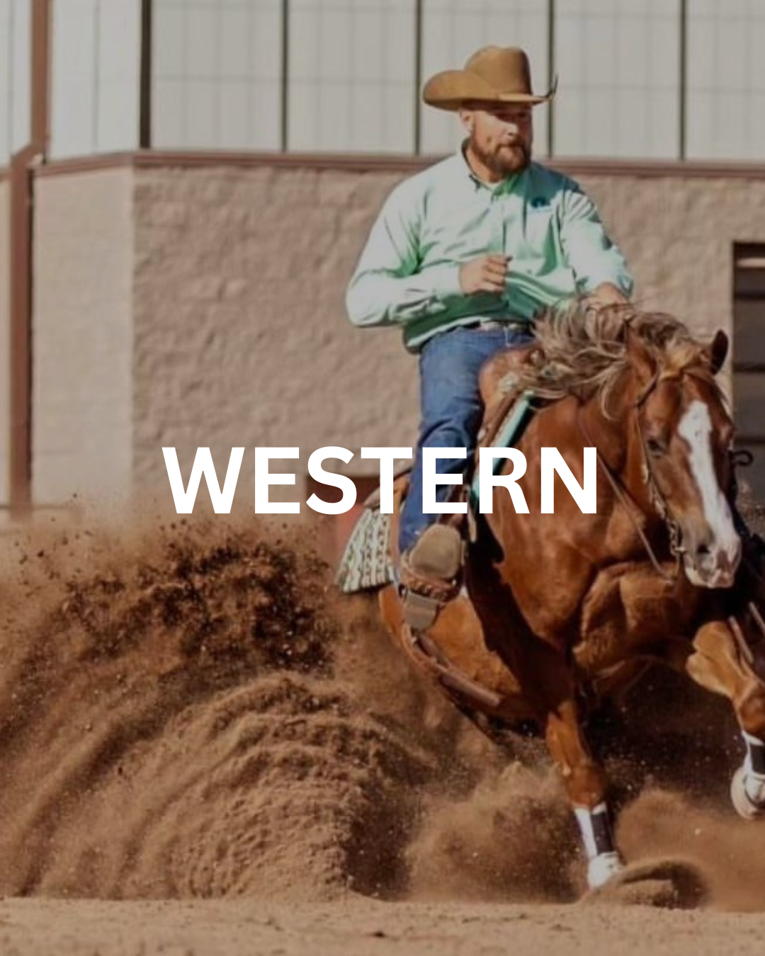 Man in western attire riding a horse, kicking up sand.