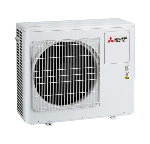 A white mitsubishi electric air conditioner is sitting on a white surface.