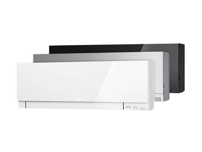 Three different colored air conditioners are stacked on top of each other on a white background.