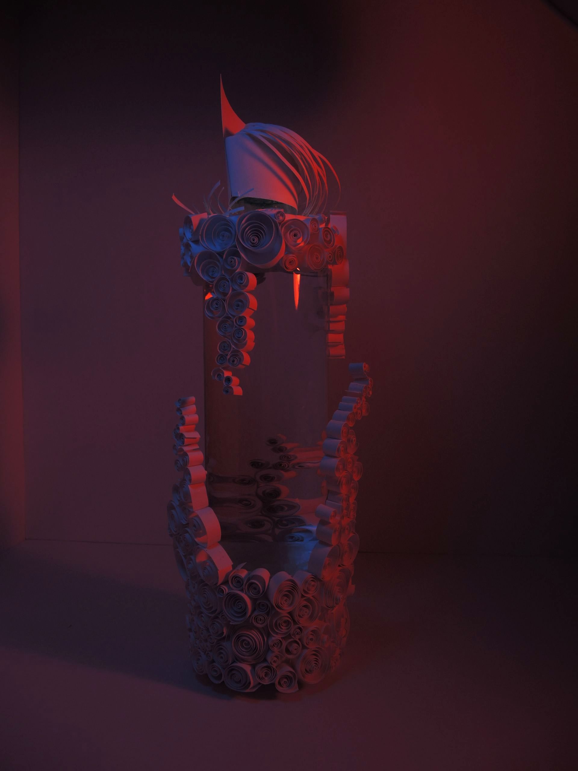 Photograph of bottle design, aiming to translate a taste experience into haptic 3D bottle packaging, approaching to focus on one sense and block out all external
impressions. Origami, paper, cutter, glue.