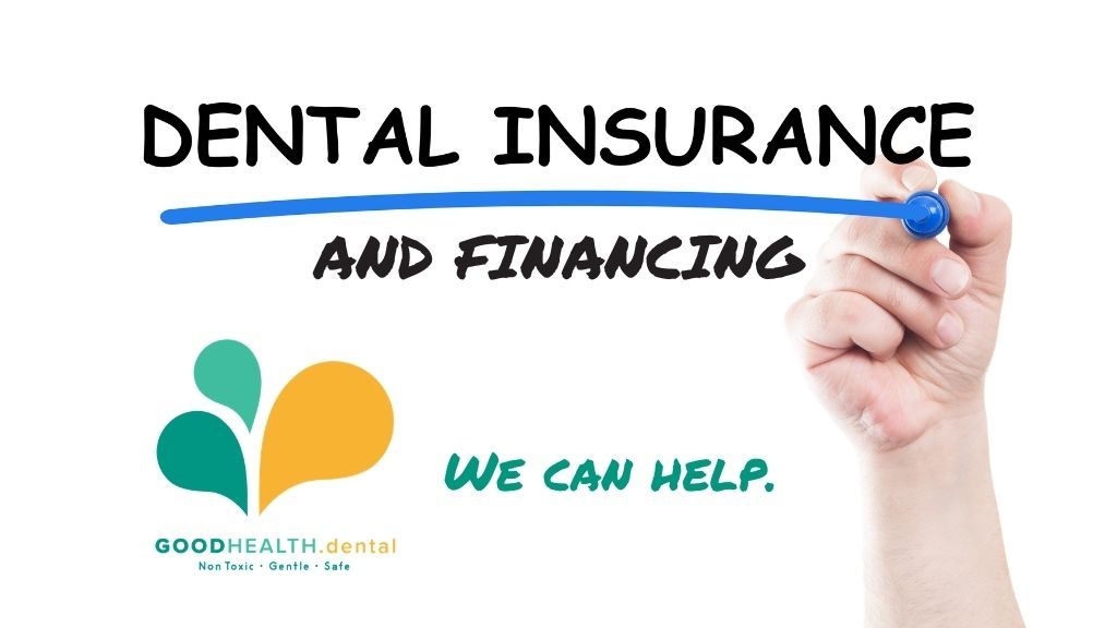A hand is writing dental insurance and financing on a whiteboard.