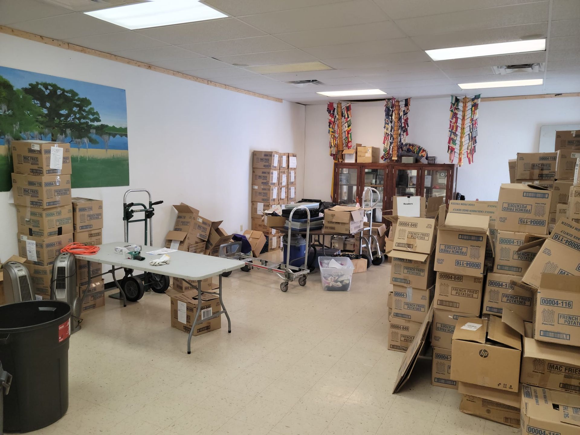A room filled with lots of cardboard boxes and a table