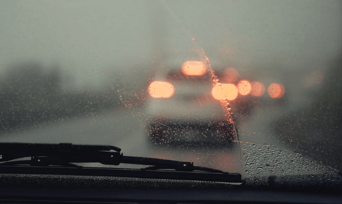 car wiper removing moisture on windshield