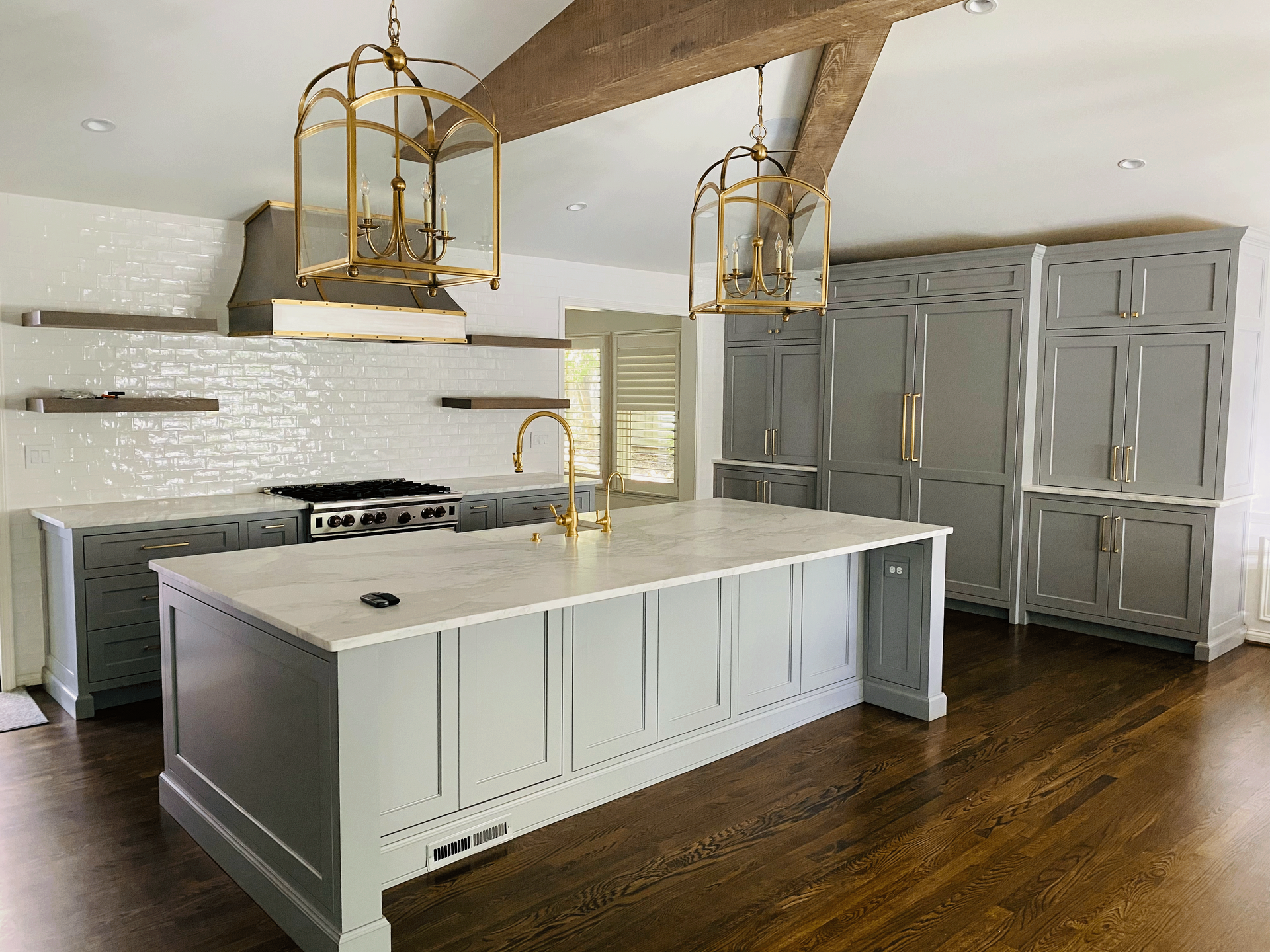 There is a large island in the middle of the kitchen.