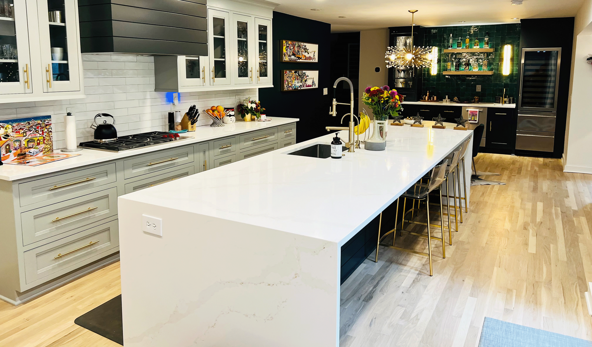 There is a large island in the middle of the kitchen.