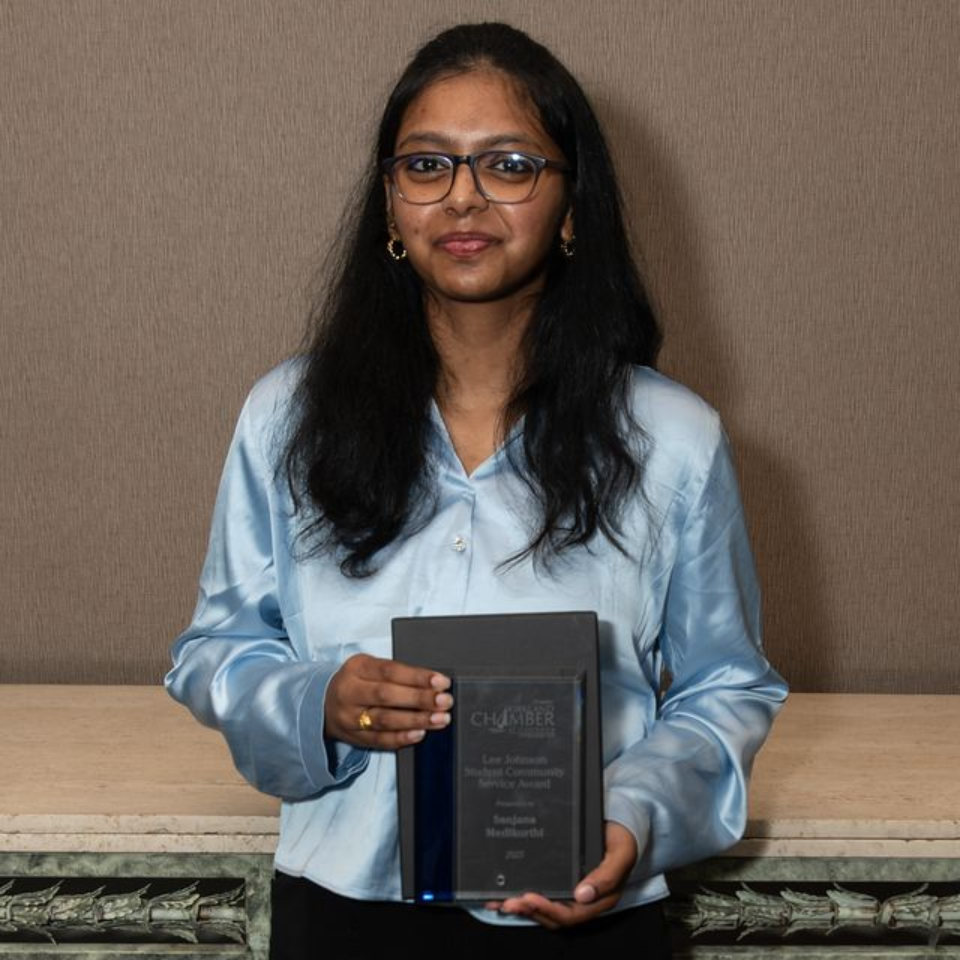 Jessica Beck presents Noah Hanculak with the Lee Johnson 'Student Community Service' award