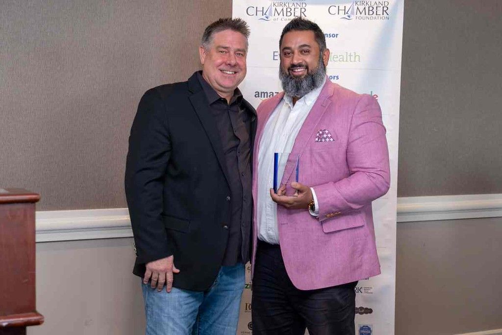 Troy McVicker presents Jaurdey Samuel with the A. Duane Lund 'Chamber Member of the Year' Award