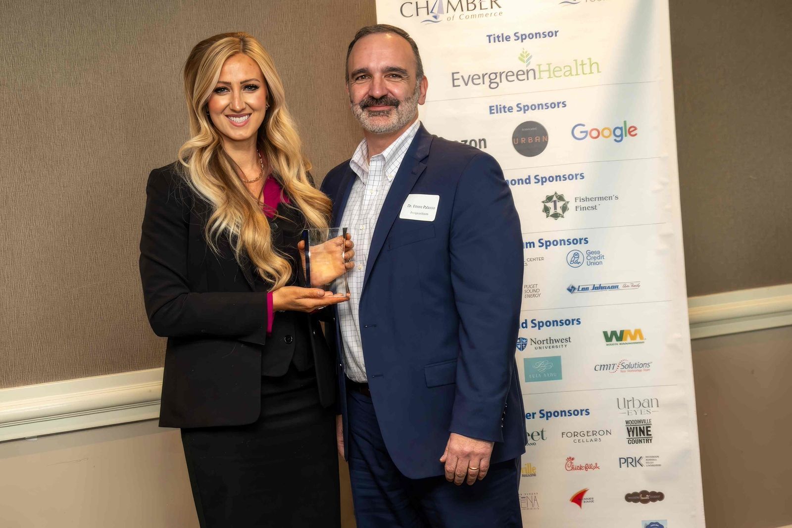 Dr. Ettore Palazzo presents Alicia Quaco with William C. Woods 'Above and Beyond' Award