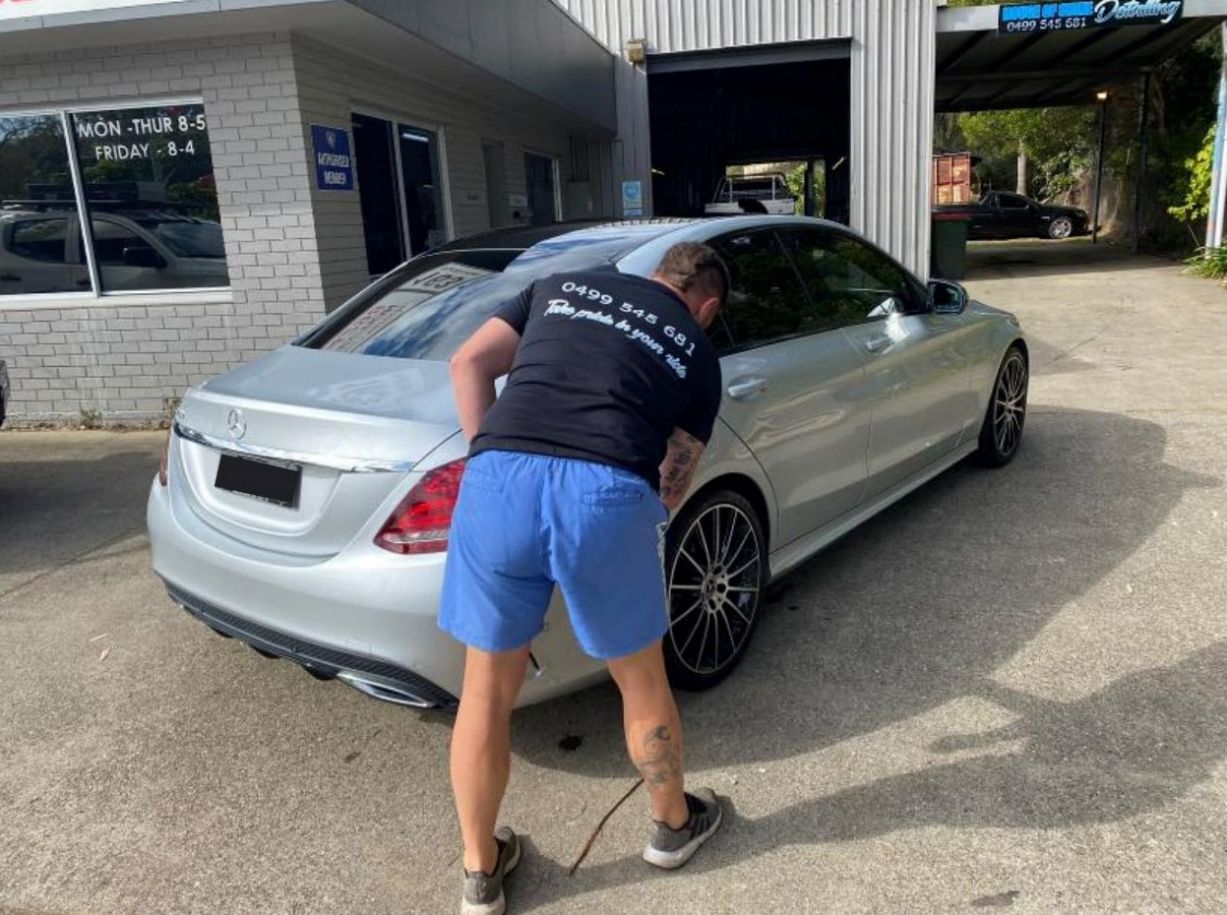 Man Polishing Silver Car — Car Cleaning in Coffs Harbour, NSW