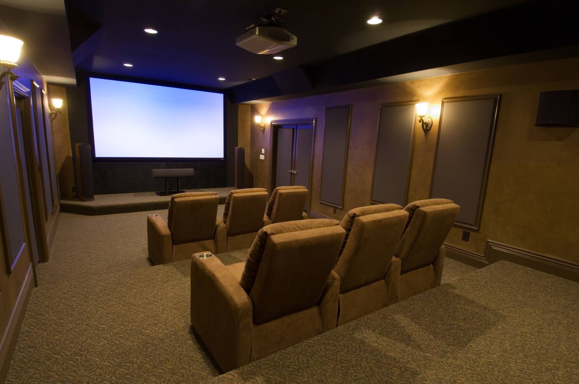 A home theater with a large screen and projector