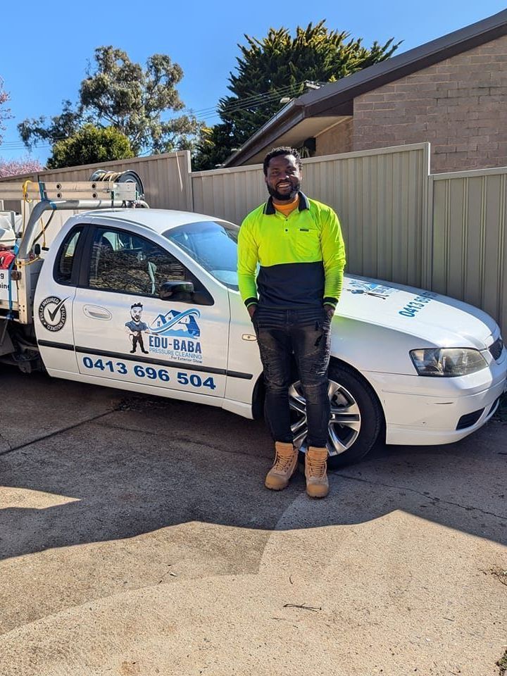 A Man Leaning Against a Car — EDU-BABA Pressure Cleaning in Evatt, ACT