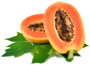 Sliced papaya with bright orange flesh, black seeds, and green leaves on a white background