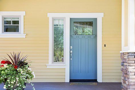 Front entrance of a home with blue door — Doors located in Las Vegas NV 89118