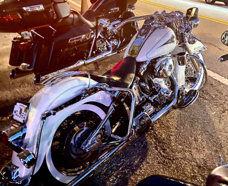 A harley davidson motorcycle is parked on the side of the road