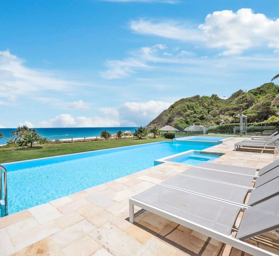 There Is A Large Swimming Pool With A View Of The Ocean — One Lane Financial In Burdell, QLD