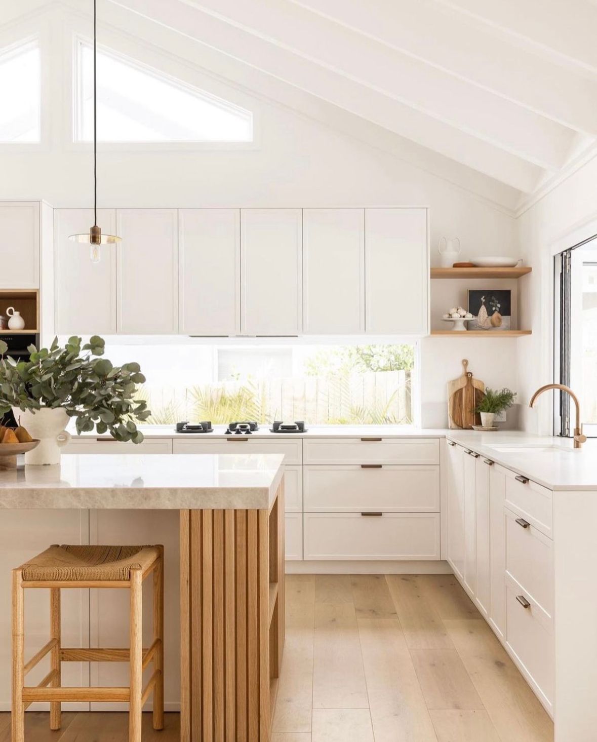 A Kitchen With White Cabinets , A Sink And A Window — One Lane Financial In Burdell, QLD
