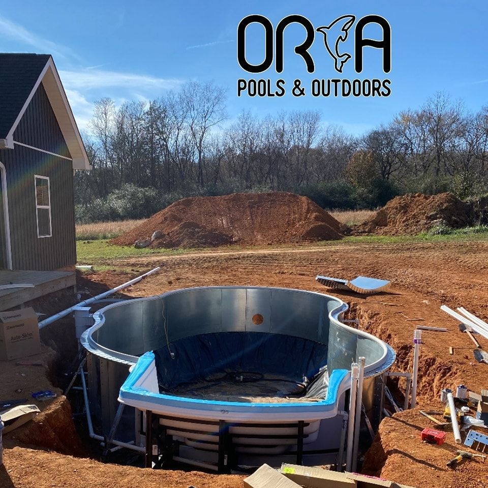 A pool is being built by orca pools and outdoors