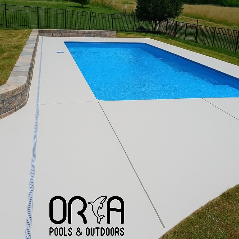 A large blue swimming pool with orca pools and outdoors written on the side