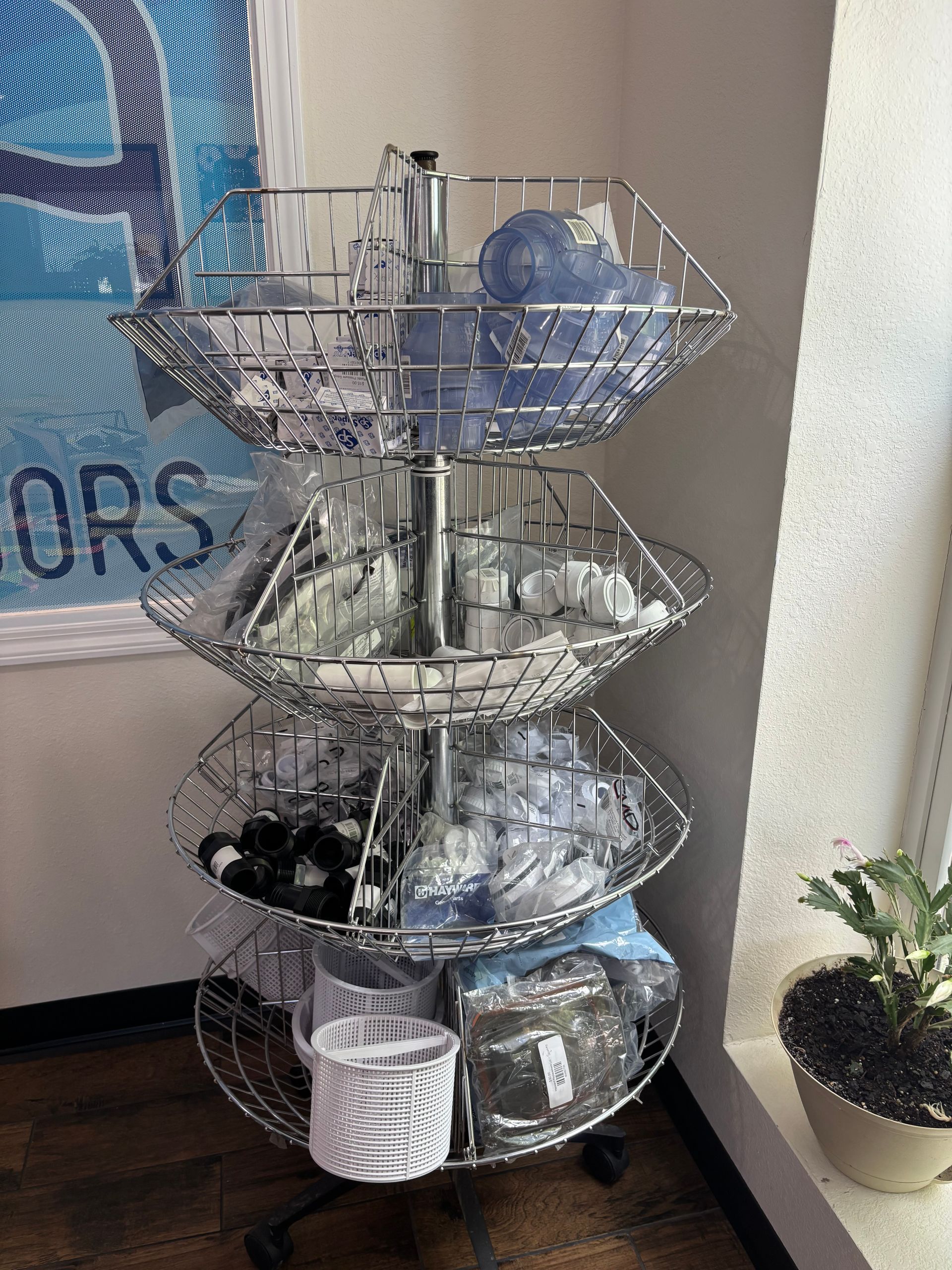 A display rack filled with baskets filled with various items.