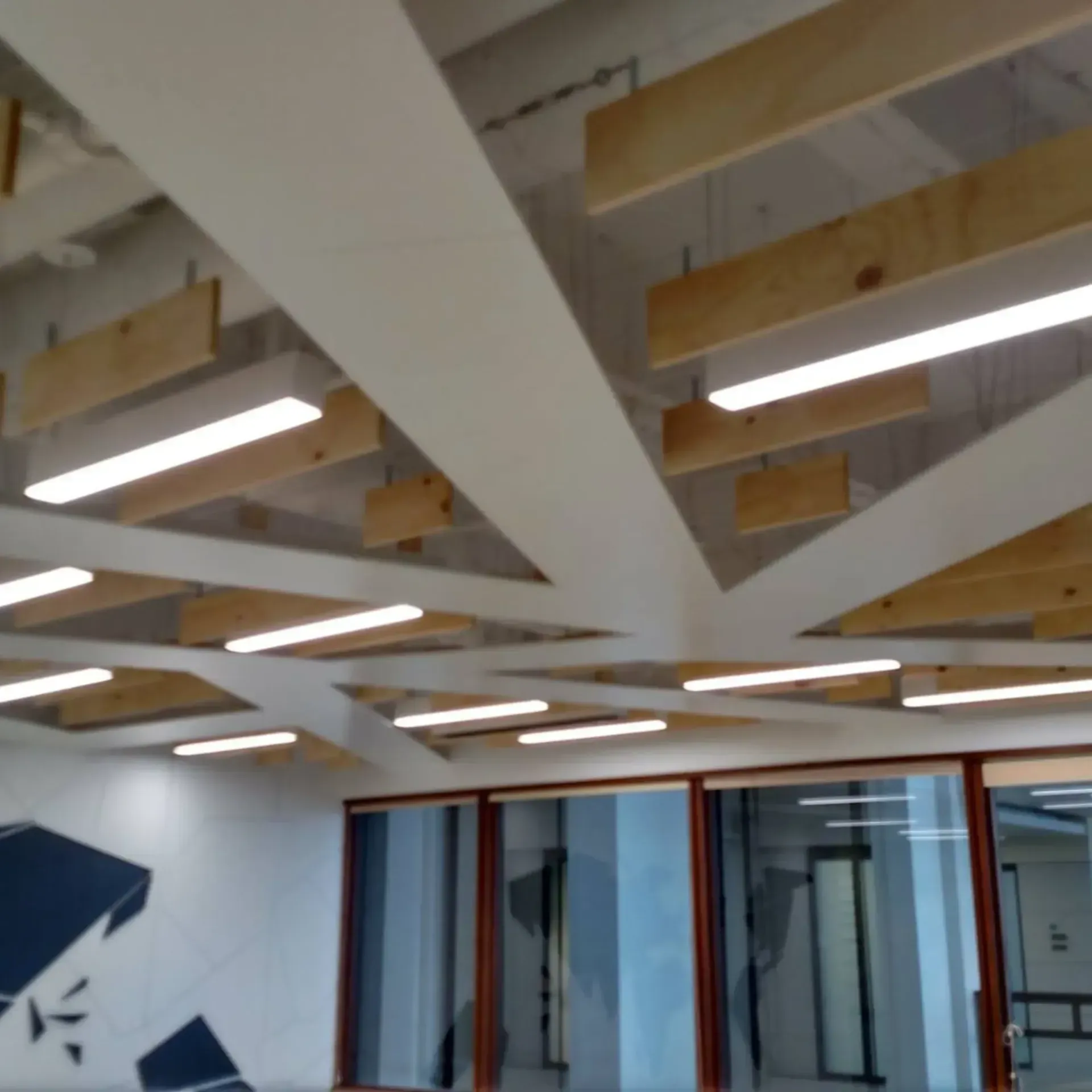 Modern office ceiling with wooden beams