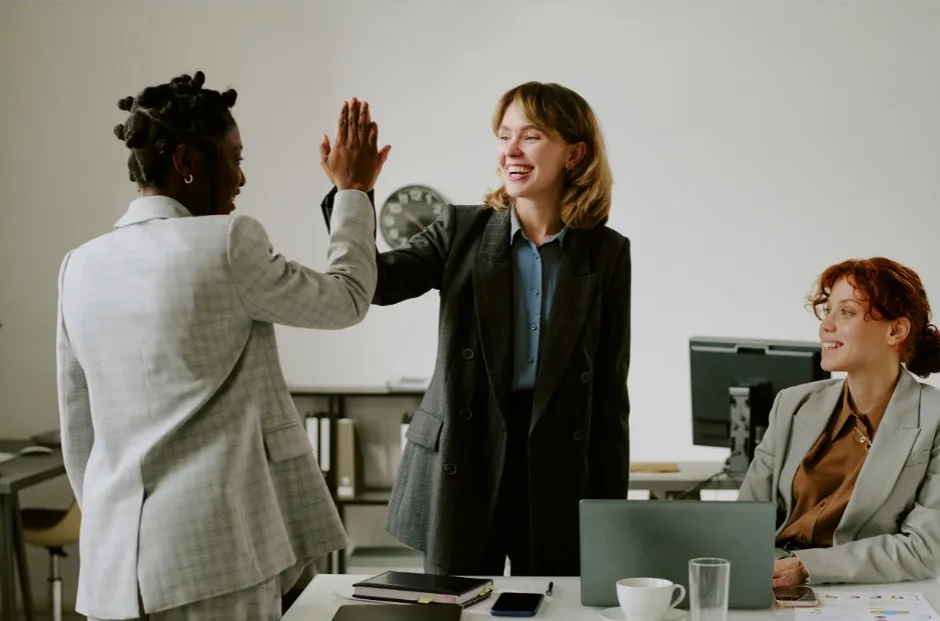 Small business owner celebrating success and growth after partnering with KPI Solutions business advisory in Chelmsford MA