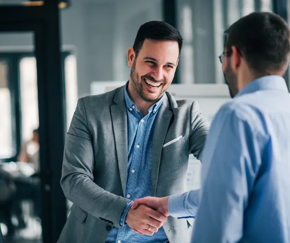 Successful executive search placement handshake business owner and new executive hire KPI Solutions Chelmsford Massachusetts