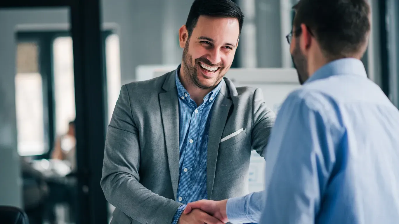 Successful executive search placement handshake business owner and new executive hire KPI Solutions Chelmsford Massachusetts