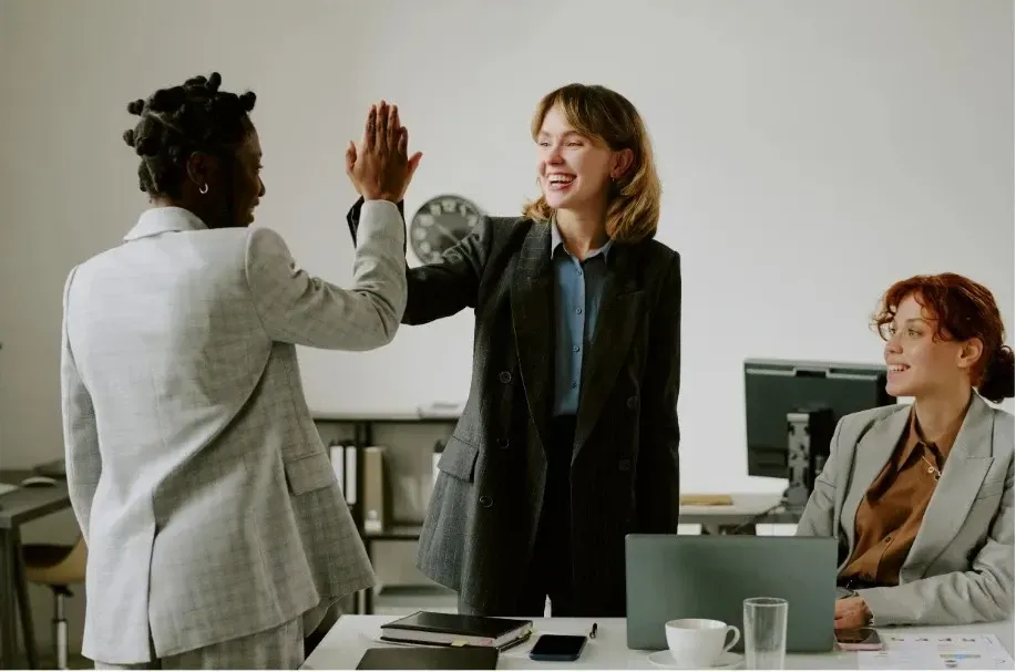 Small business owner celebrating success and growth after partnering with KPI Solutions business advisory in Chelmsford MA