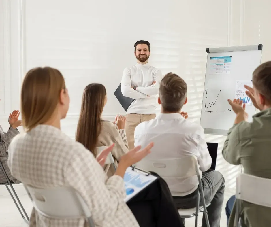 Business leadership team reviewing operational growth results and improved performance metrics Chelmsford Massachusetts